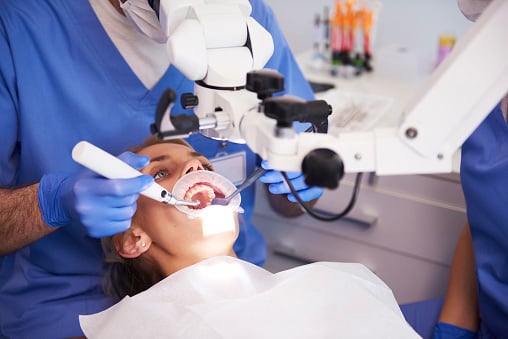 Young woman receiving a root canal at Virginia Surgical Arts in Virginia Beach, VA