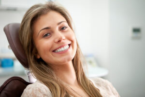 Young woman smiling during wisdom teeth removal consultation at Virginia Surgical Arts in Virginia Beach, VA