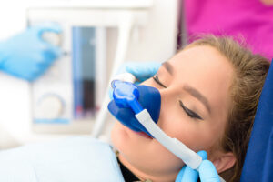 Young woman receiving sedation for wisdom teeth removal at Virginia Surgical Arts in Virginia Beach, VA.